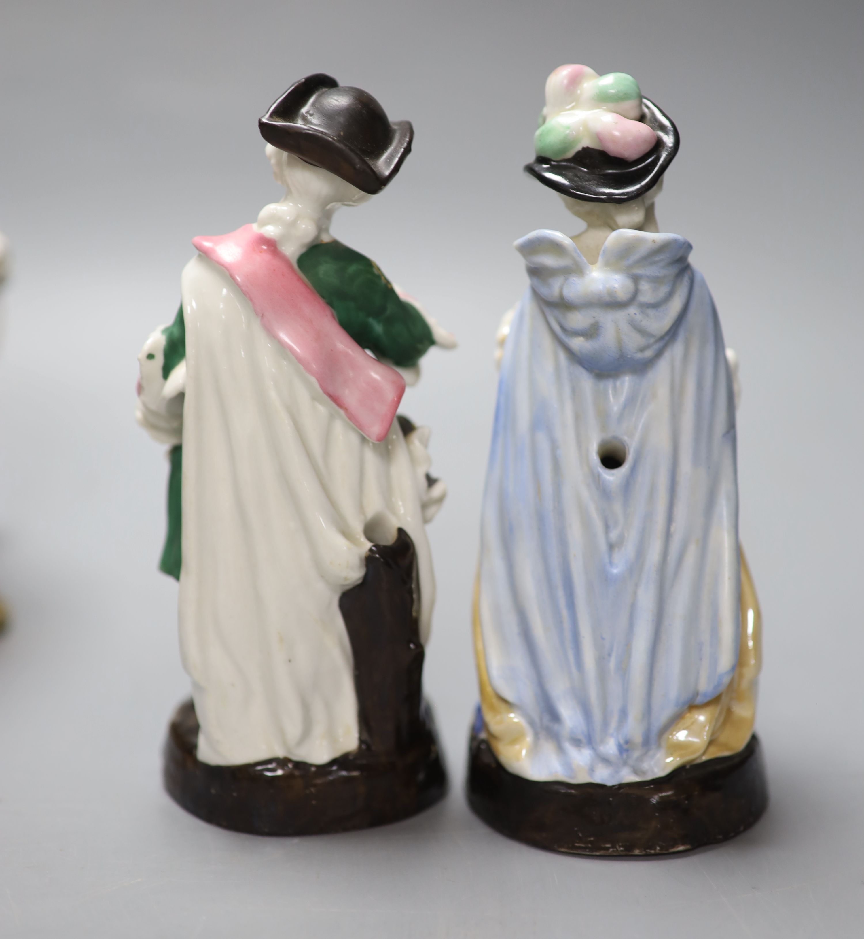 A Dresden porringer and three Continental porcelain figure groups, tallest 21cm